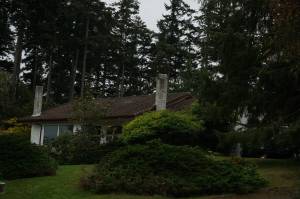 A house on Northeast Third Street in Coupeville suffered some damage to the bathroom but ultimately survived a Monday blaze. (Photo by Sam Fletcher)