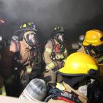 Firefighters conduct a live burn training in 2021. (Photo by John Fisken)