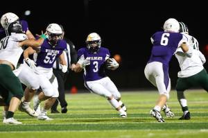 Photo by John Fisken
Oak Harbors Jayson Champignon runs with the ball during the Wildcats 49-21 victory Oct. 11 against Mount Vernon. Oak Harbor has an overall record of 6-1 and wraps up their regular season Friday hosting North Kitsap.