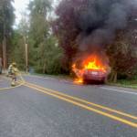 (Photo provided by South Whidbey Fire/EMS)
A car caught on fire Thursday morning in Freeland when it struck a tree.
