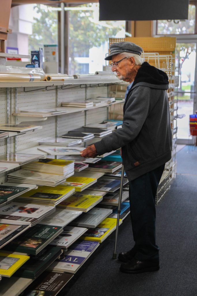 After 60 years of working at the store, Gene isnt interested in quitting what he loves doing. (Photo by Luisa Loi)