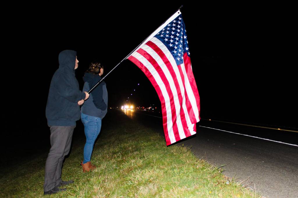Photo by Sam Fletcher
Flags were held aloft during the solemn procession.