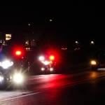 Police escort the hearse carrying Lt. Serena Dug Wileman, one of the two aviators lost in the Oct. 15 EA-18G Growler crash during routine training near Mount Rainier, as she returned home from Dover Air Force Base on Monday. (Photo by Sam Fletcher)