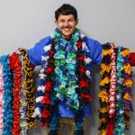 (Photo by Luisa Loi)
Roman Larsen proudly shows some of his handmade scarves. While it normally takes him a few days to finish one, he has been able to create scarves in less than an hour.