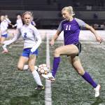 (Photo by John Fisken)
Oak Harbors Addisen Boyer maneuvers the ball past a Sedro-Woolley defender during a district playoff game Tuesday against Sedro-Woolley where Boyer topped 100 career goals.