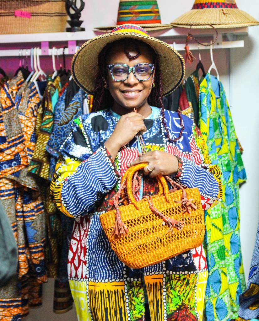 (Photo by Luisa Loi)
Dei tries on some African clothes and accessories.