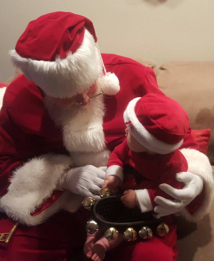 (Photo provided)
Santa Claus holds a baby Santa Claus.