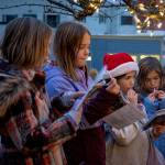 (Photo by David Welton)
With candy canes in hand, kids sing Christmas carols.