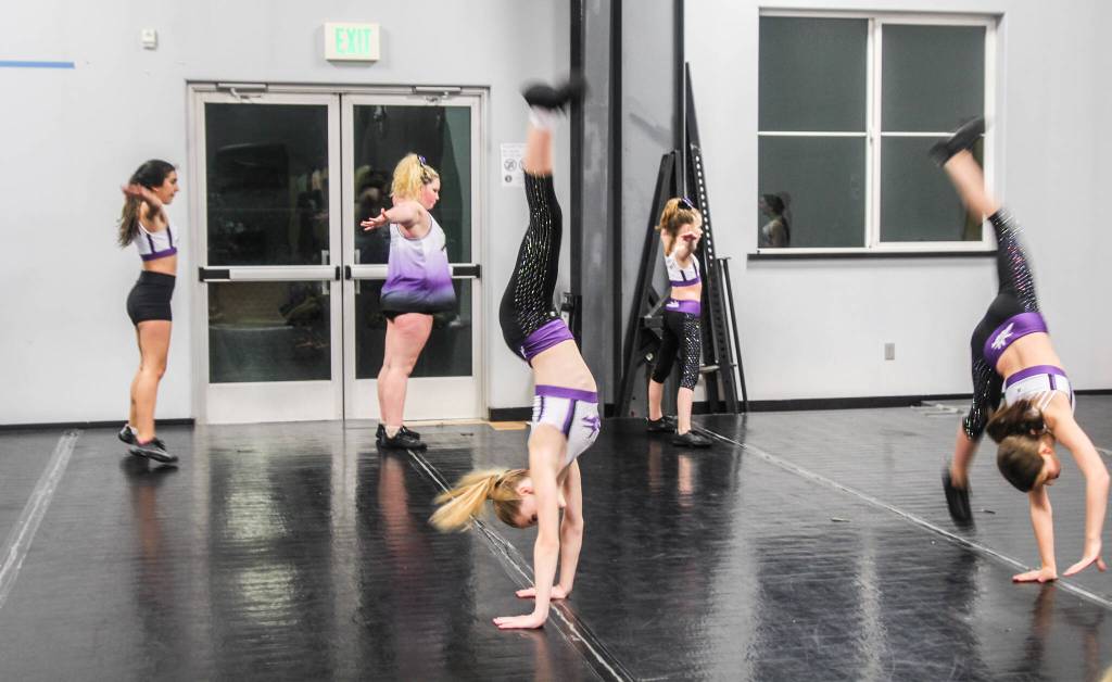 (Photo by Luisa Loi)
At left, Jade Garcia, Maci Walker, Ambria Provoncha, Abbigail Bliss and Mads Hettenbach rehearse their choreography.
