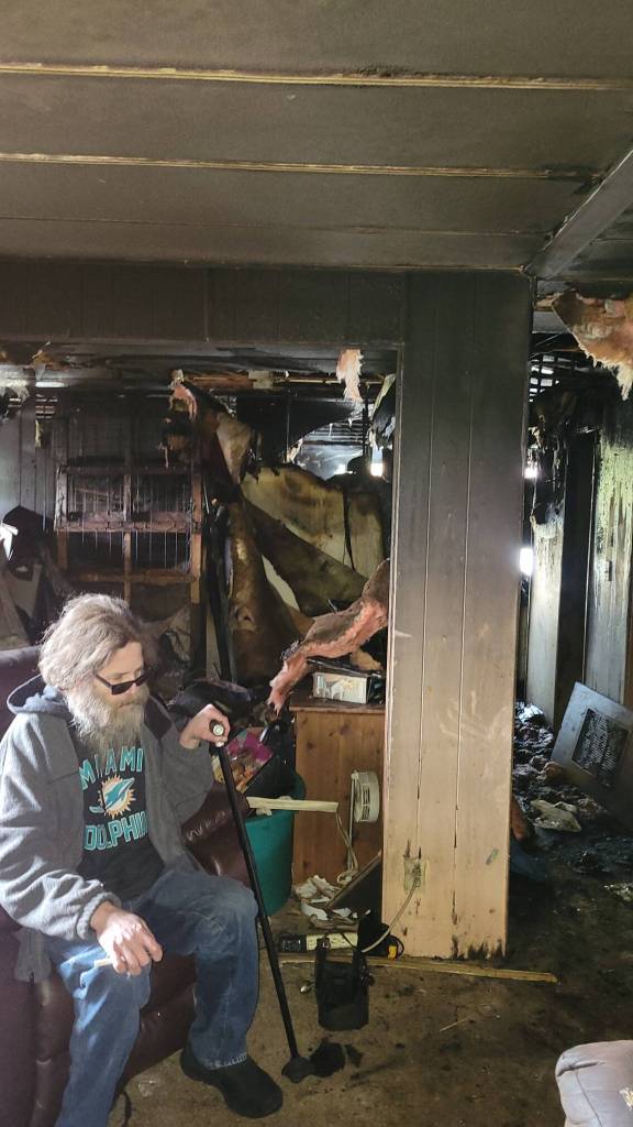 (Photo provided)
Matt Kieke sits among the remains of the home he has lived in for the past year and a half. While he made it out alive thanks to Tim Nettlebeck, his 5-month-old kitten did not survive.