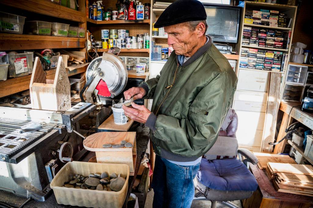 (Photo by David Welton)
John Schmidt sifts through his rock collection.