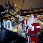 (Photo by David Welton)
Santa Claus (Steve Lamb) encourages firefighter Cooper Ullmann to keep going as he nears 100 floors.