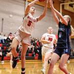 (Photo by John Fisken)
Lexis Drake banks in a shot while Chelsi Stevens comes flying in to help.