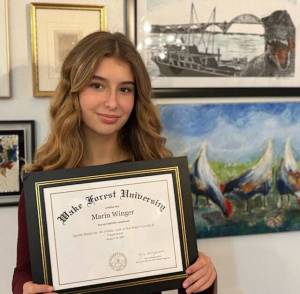 Marin Winger shows off her credentials. (Photo courtesy Robin Bernardy)