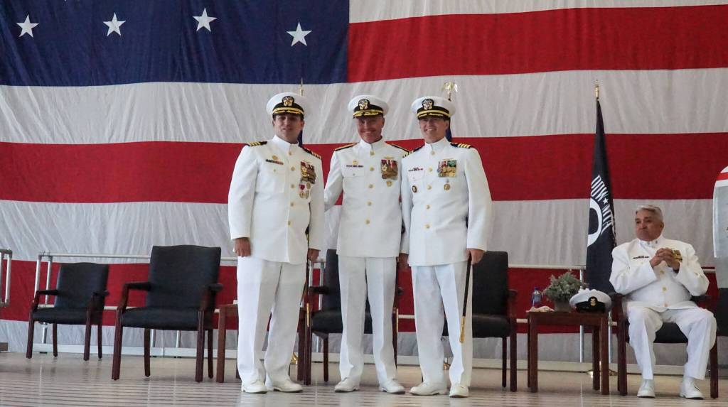 (Photo by Sam Fletcher)
From left, Commanding Officer Capt. Eric Hanks, Rear Admiral Mark Sucato and relieving Commanding Officer Capt. Nathan Gammache posed at the change of command ceremony on Aug. 15.