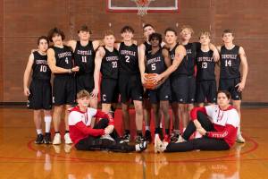 Photo by John Fisken
The boys varsity basketball team poses.
