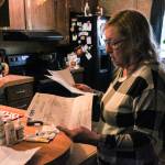 Denis Muller, a resident of Parkwood Manor Mobile Home Park, revies water testing results from Edge Analytical Laboratories. (Photo by Sam Fletcher)