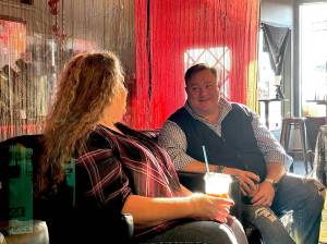 Photo by Sam Fletcher
 Oak Harbor Mayor Ronnie Wright chats with Teresa Besaw, marketing coordinator of Oak Harbor Main Street, Friday morning.