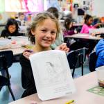 Photo by Luisa Loi
First grader Hazel Bratt, a student in Rachal Marcus art class, shows her Moana drawing.