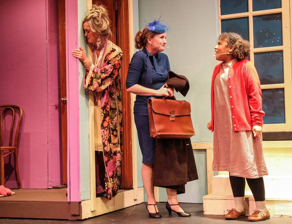 (Photo by Luisa Loi)
Miss Hannigan (Abby Thuet) has a hard time accepting that Grace Farrell (Liz Hendrikcs) is inviting Annie (Selah Rivera) to spend Christmas at a millionaires mansion.
