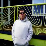 Photo by David Welton
Jim Bernacki stands before the bright green deck rail he welded for his own home on South Whidbey.