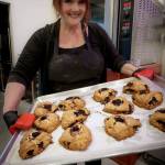 Photo by David Welton
Laura Wills holds up a tray of freshly baked marionberry scones.