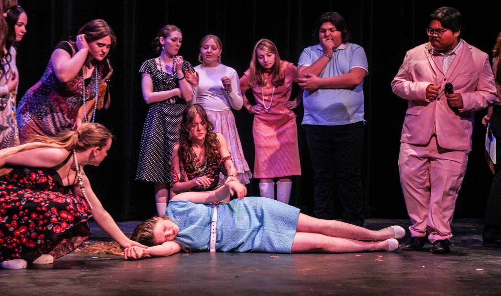 (Photo by Luisa Loi)
Overwhelmed with excitement, a young woman (played by Violet Altig) collapses during the filming of her favorite show.
