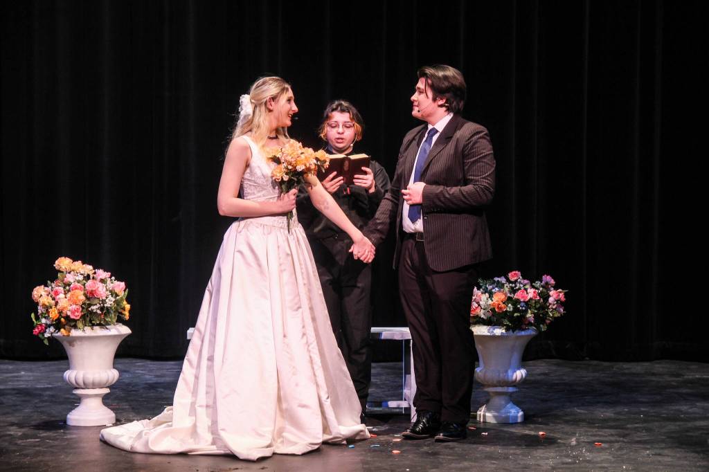(Photo by Luisa Loi)
In this scene, titled Raindrops Keep Falling on my Head, a pastor (Matt Uranga) officiates the wedding between an anxious and perfectionist man (Lucas Smith) and the love of his life (played by Sabrina Cray).