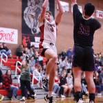 (Photo by John Fisken)
Jack Porter delivers presents to the hoop.