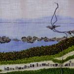 (Photo by David Welton)
Different stitches lend varied textures to the rocks, grasses, rosehips and clouds featured in this landscape.