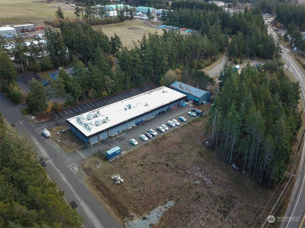 The city plans to buy the long building and the adjacent undeveloped property. The building would be used as a training facility for first responders. There are currently no plans for the undeveloped property, though OHPD Chief Tony Slowik said a new police department building could be built there in the future. (Photo from Realty.com)