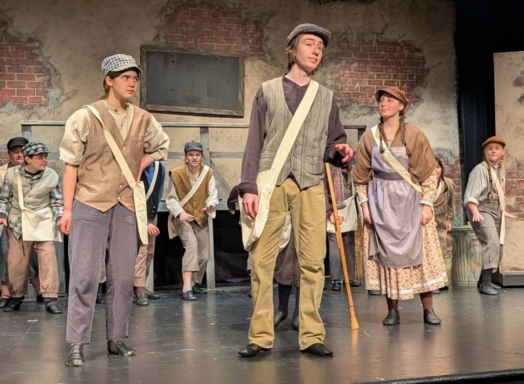 (Photo by Jenica Deer-Cerda)
From left, Muriel (Lydia Rieneckert), Jack Kelly (Noelani Martin) and Race (June Murray) are among the newsies who go on strike.