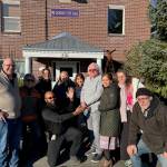 (Photo provided)
City staff gather around Bob Herzberg in front of Langley City Hall.