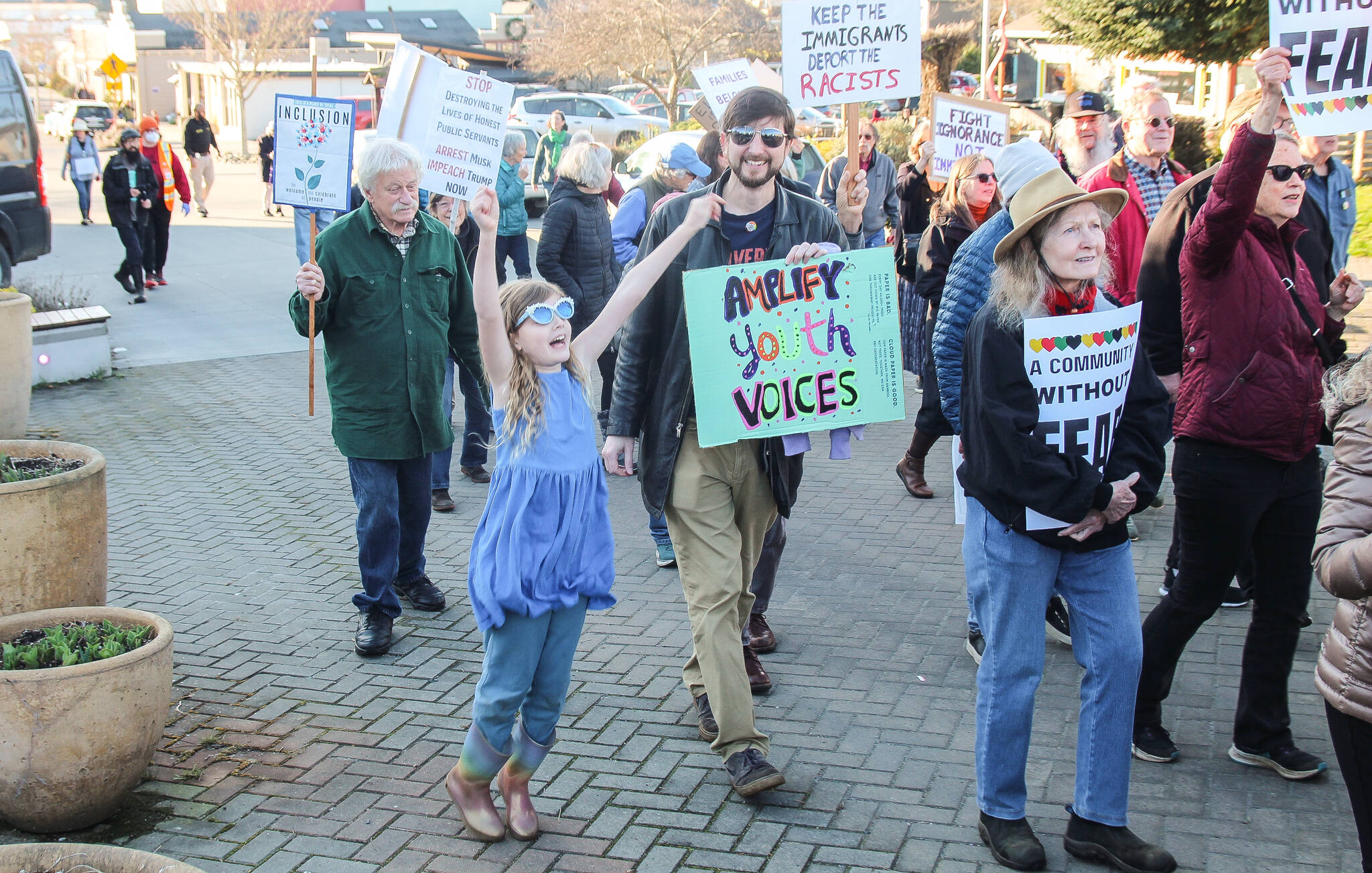 (Photo by Luisa Loi)
South Whidbey Schools Board President Brook Willeford, seen holding a sign saying amplify youth voices, was among the community members who marched Friday.