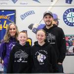 At left, Abby, Hunter, Tessa and Chad Meyer pose together in their new Oak Harbor shop. (Photo by Luisa Loi)