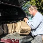 (Photo by Luisa Loi)
Jerry Sanders, president of the Rotary Club of Oak Harbor, gets the bags ready for delivery.