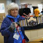 Musselfest Chair Kellie Sites holds a belt studded with real diamonds, which will be awarded to the winner of the Mussel Tussle.