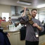 Mussel Tussle winner Michael Wieczorek holds his mussel belt for the crowd to see. The next day, Chef Michael Weeks from Callens dueled against Sean Prater from Captain Whidbey, who won.