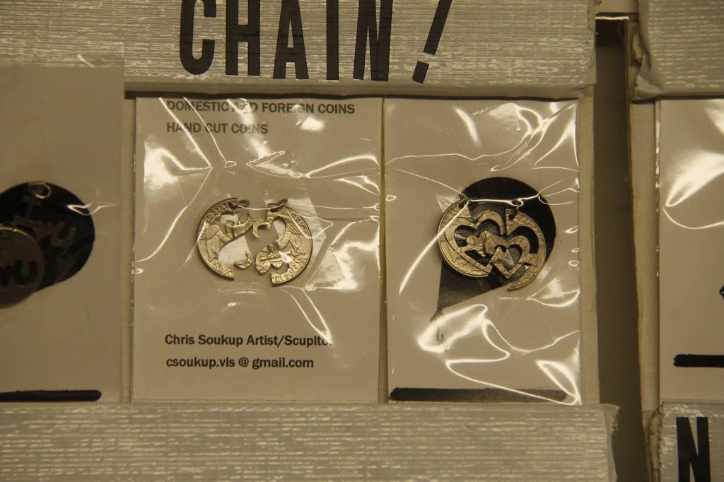 (Photo by Kira Erickson/South Whidbey Record)
Chris Soukup came up with a friendship necklace design, interlocking pieces of the same coin that can be worn by two different people.