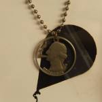 (Photo by Kira Erickson/South Whidbey Record)
George Washington smokes a doobie in this pendant made from a U.S. quarter.