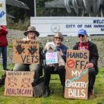 At left, Suzanne Fageol, Peggy Taylor, doge Havi and Rick Ingrasci smile in front of the Navy aircraft monument. (Photo by Luisa Loi)