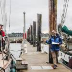 (Photo by Luisa Loi)
Captain Brian Vick, at right, explained a group of volunteers in training, at left, how to respond to emergency situations. The group met at the Oak Harbor Marina, where Suva will stay until it sails to Penn Cove on April 25.