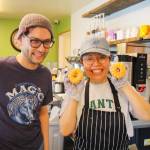 At right, Gene Hainey and his mother, Okhui Chang, pose for a photo at their new family bakery in Oak Harbor. The donuts were baked by Okhui and her husband, Seong. (Photo by Luisa Loi)