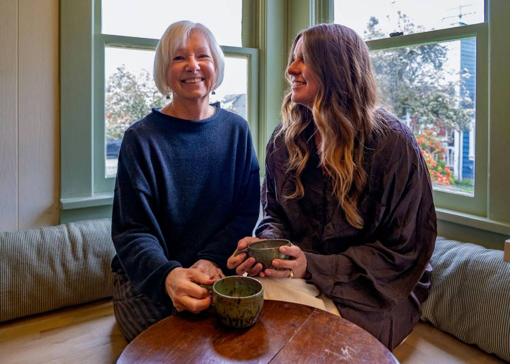 Diane Sorensen, left, and daughter Berty Hansen in the kitchen of Alma Kids, where monthly events are held for the community. (Photo by David Welton)