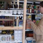 Photo by Patricia Guthrie
Sometimes customers request a certain product they once tasted by can’t remember by name. That sends Whidbey Provisions owner Katie Oakes Stevens off on a foodie scavenger hunt. Here she shows off one such quest, a fermented spicy brown mustard made by OlyKraut of Olympia.