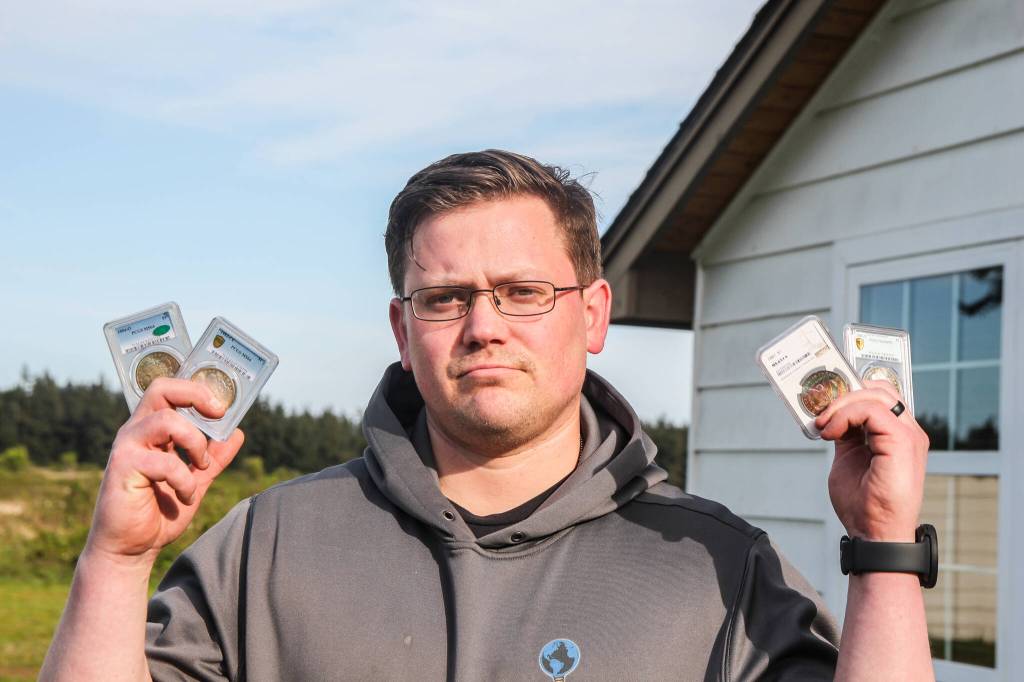 Photo by Luisa Loi
Hale holds some of his favorite silver coins, the Morgan Silver Dollars that were authenticated by the Professional Coin Grading Service.