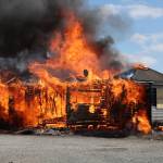 (Photo by John Fisken)
After numerous burns, the house was finally burned to a crisp, ready to make way for a new building.