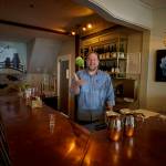 Photo by David Welton
Ed Hodson, sommelier, flips a bottle of wine into the air behind the new bar in Japonica Diner.