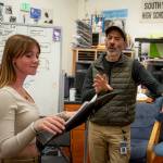 Chris Harshman works with eighth grader Emma-Tara Lee on her voice skills before singing Rolling in the Deep. (Photo by David Welton)