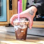 Koehler Stephens serves an Aviator Latte to a freelance reporter. The anchors tattooed on her hand represent the time she served as boatswains mate on the USS Abraham Lincoln.